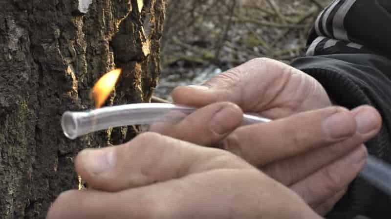 heating the tube with fire